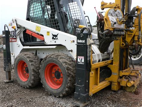 skid steer mounted rock drill|drilling rig attachments for bobcat.